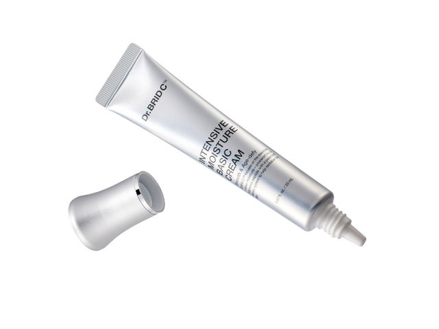 A silver bottle on its side with the top separate against a white background.