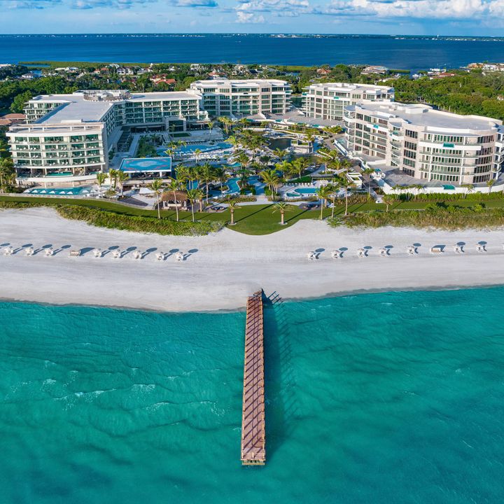 An aerial view of The St. Regis Longboat Key Resort as seen from the beach and water.