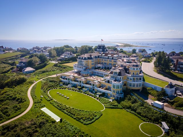 An aerial view over the large yellow New England estate beachfront property of Ocean House in Rhode Island.
