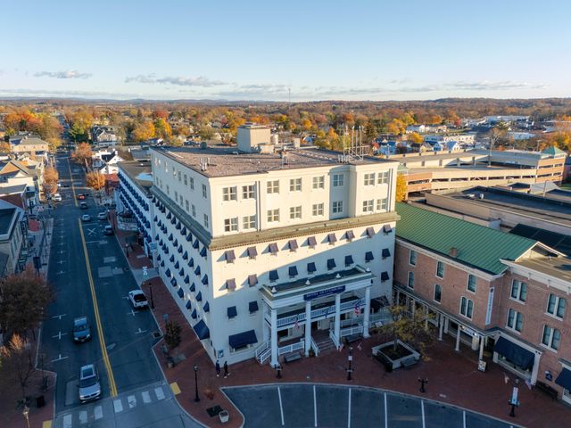 An aerial view over Gettysburg looking down at Hotel Gettysburg in the fall.