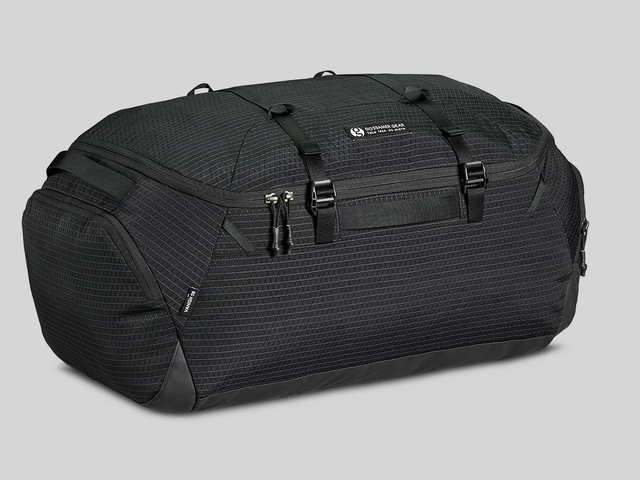A black duffel bag against a white background.