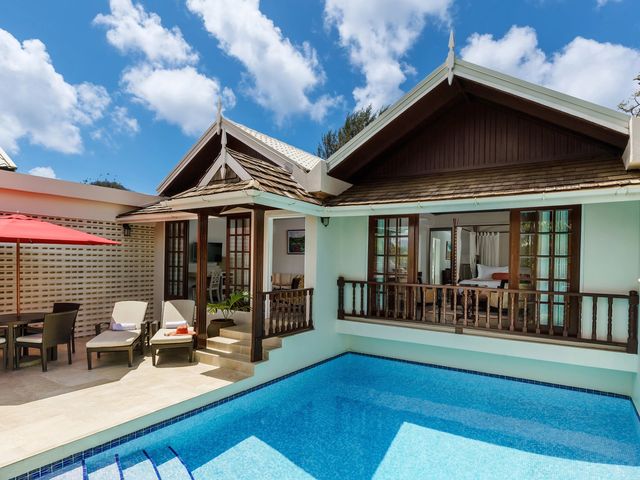 A hotel room at Spice Island Beach Resort with a private plunge pool.