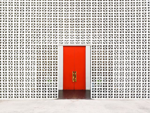 The iconic white and orange entrance to the Parker Palm Springs