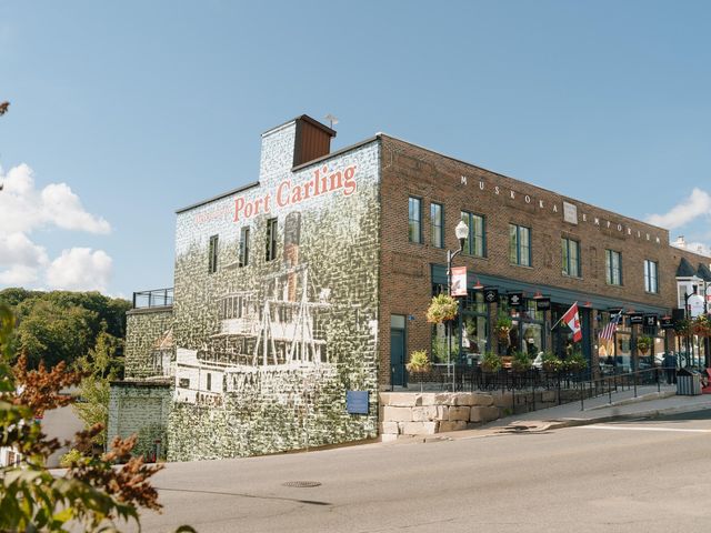 Downtown Port Carling, with a mural painted on the side of a building in a charming Main Street area.