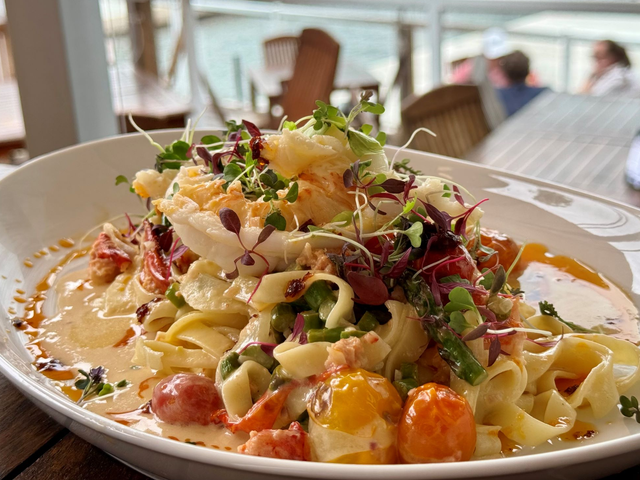A beautiful plate of noodles topped with various accoutrements at a lakeside restaurant in Muskoka.