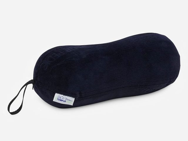 A black lumbar pillow against a white background.