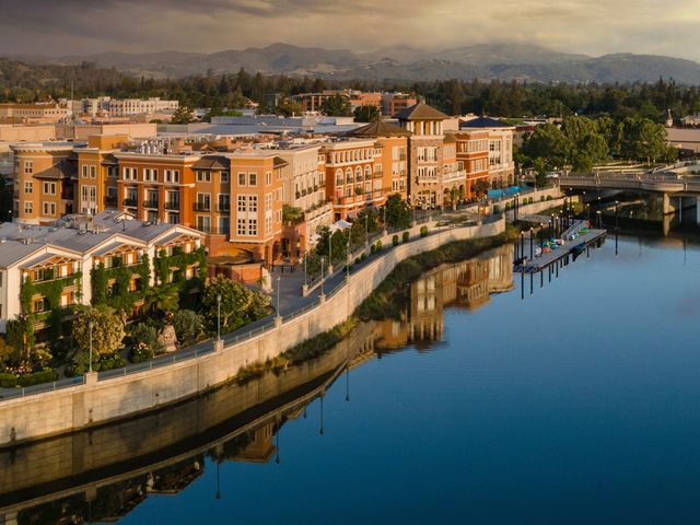 Aerial view of downtown Napa, California with a riverfront reflection.