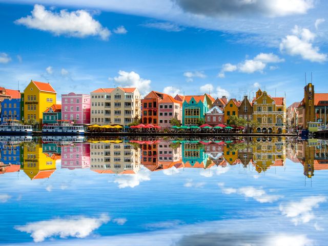 The colorful buildings of Willemstad in Curacao that line the water.
