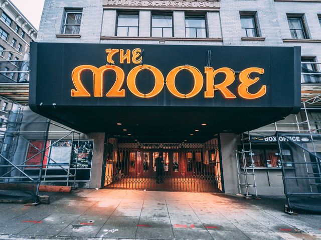An awning outside a building that says The Moore.