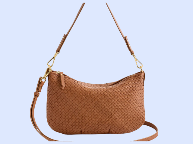 A brown braided purse against a white background.