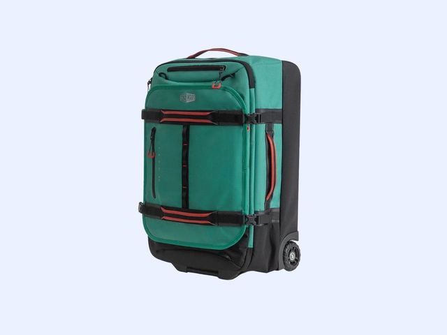 A turquoise and black duffel with orange accents seen from the side, with wheels in the back, against a blue background.