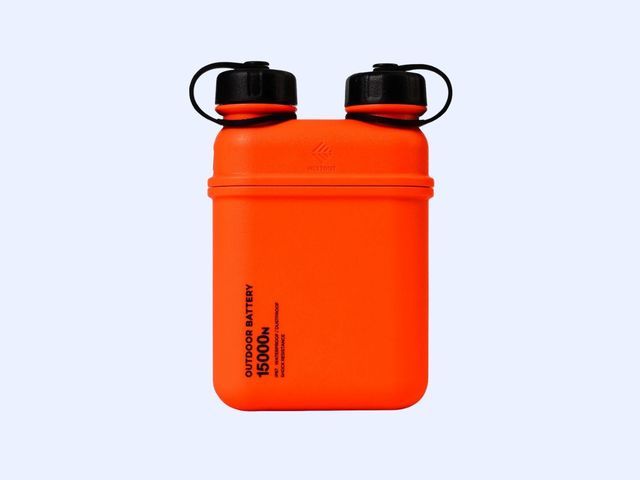 A bright orange portable battery against a blue background.