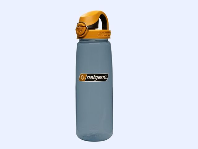 A grey and yellow Nalgene bottle with a clipped lid against a blue background.