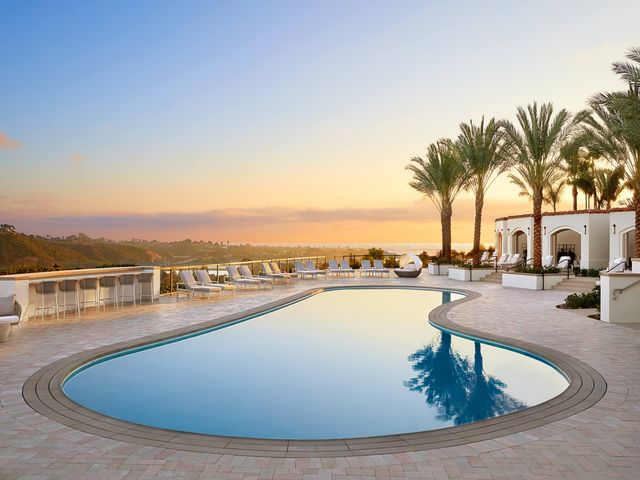 The adult pool at Park Hyatt Aviara with a lagoon shape, as seen at sunset.