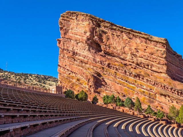 Rows of seats and rock formations at Red Rocks Park and Amphitheatre.