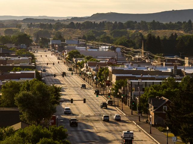 An aerial view over the main street of downtown Cody, Wyoming at morning just after sunrise. 
