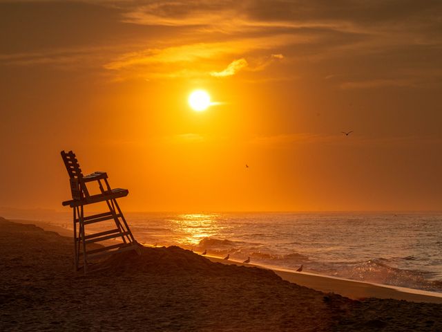 A lifeguard chair at Hither Hills State Park at sunset