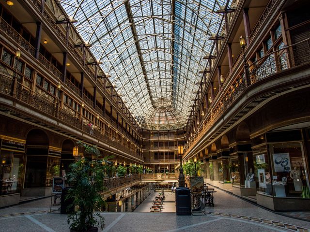 The interior of the Old Arcade and Hyatt Hotel in Cleveland with intricate ceiling, balconies, and ironwork.