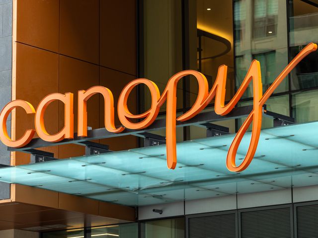 The Canopy logo sign on a Canopy Hotels by Hilton location