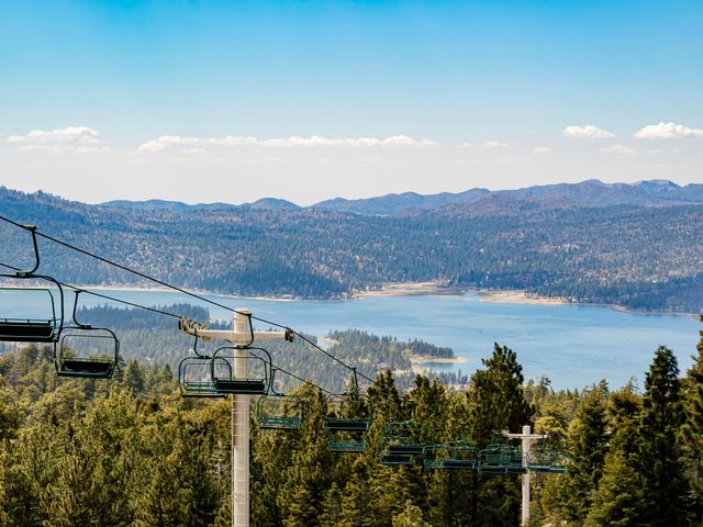 A chair lift rising over Big Bear Lake.