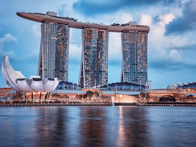 The modern exterior with three columns and a rooftop portion covering all at the Marina Bay Sands Singapore.