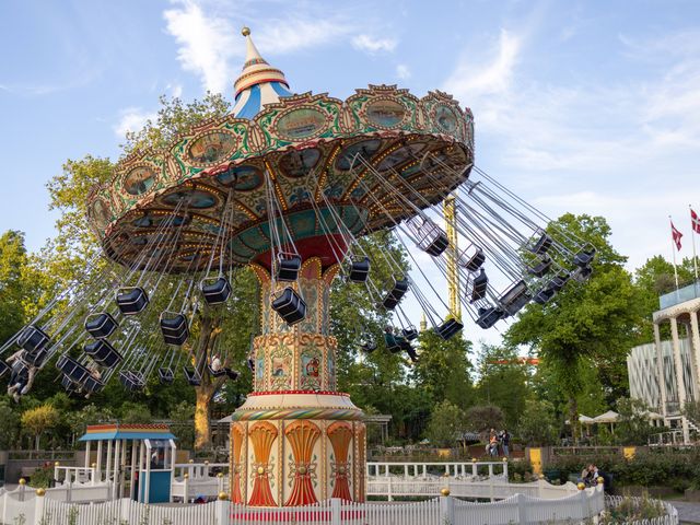 A swing ride with the seats twirling in the air at Tivoli Gardens in Copenhagen.