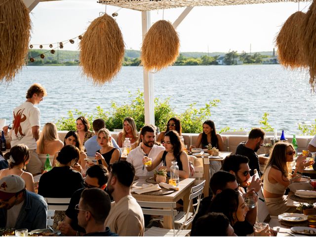 A crowded patio next to the water at The Surf Lodge in Montauk.