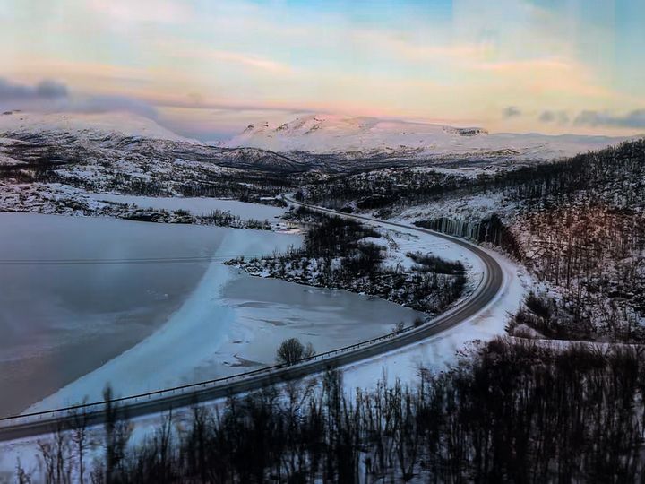 A snowy mountain landscape in Sweden as seen from a train