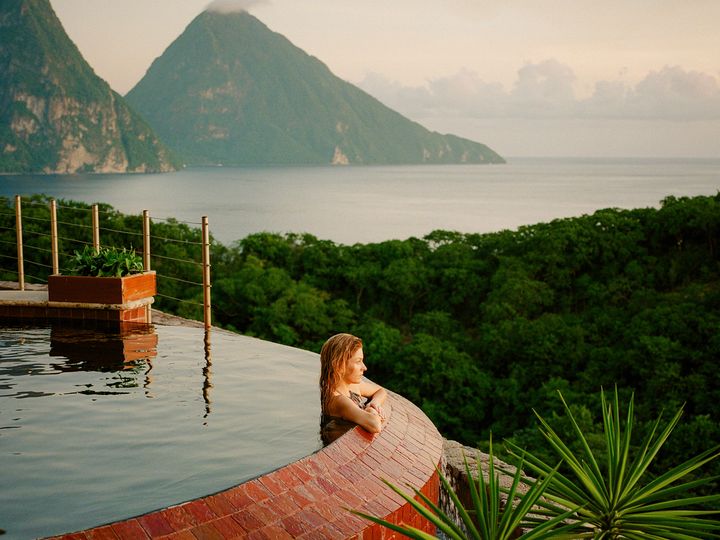 A woman at the edge of a private infinity pool at Jade Mountain Resort in St. Lucia.