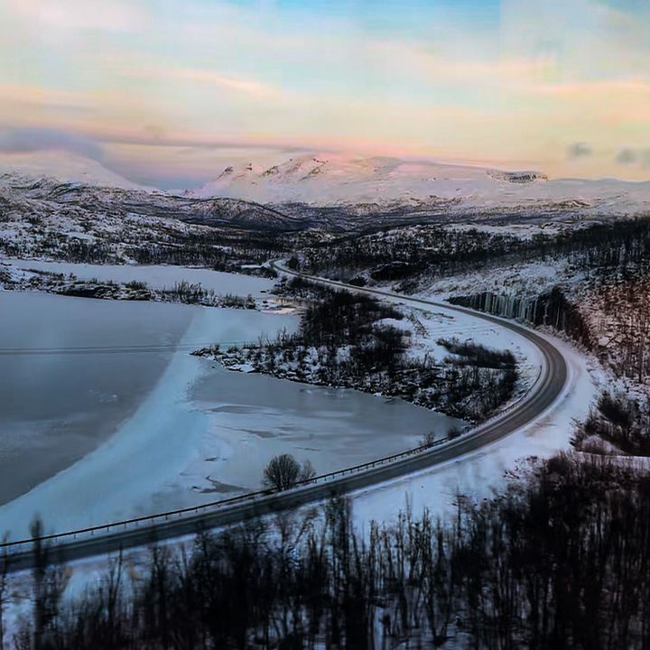 A snowy mountain landscape in Sweden as seen from a train