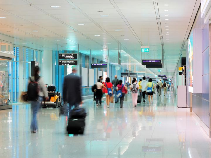 Foot traffic moving through airport terminal