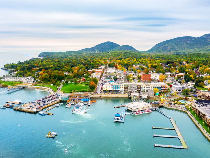 An aerial view over the town of Bar Harbor on Mount Desert Island and its harbor and waterfront in Maine.