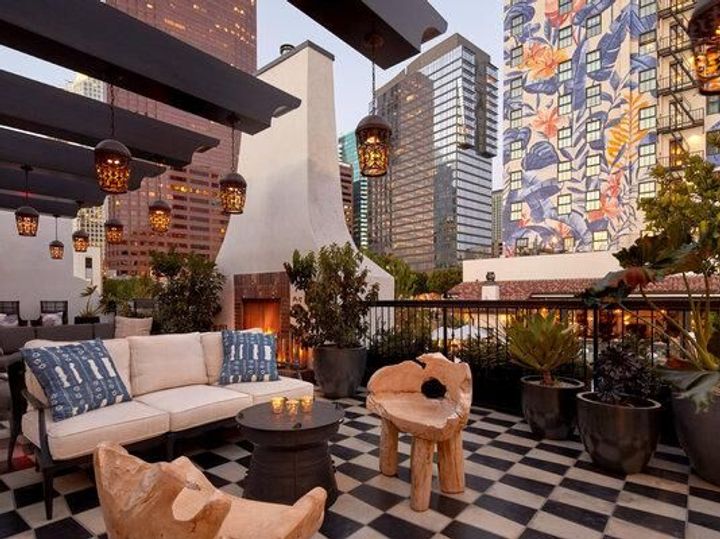 A terrace surrounded by skyscrapers at Hotel Figueroa in LA.