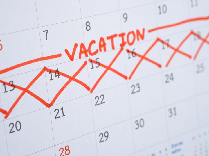A week on a calendar is marked off with red Xs and the word ‘vacation.’