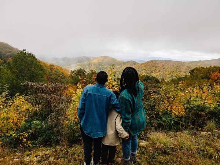 Family enjoying scenic fall foliage in the North Carolina Mountains