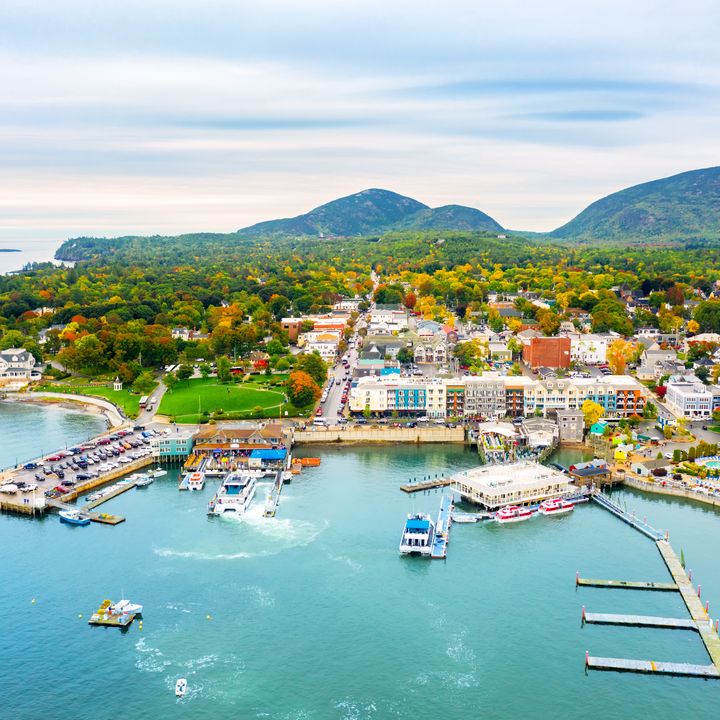 An aerial view over the town of Bar Harbor on Mount Desert Island and its harbor and waterfront in Maine.