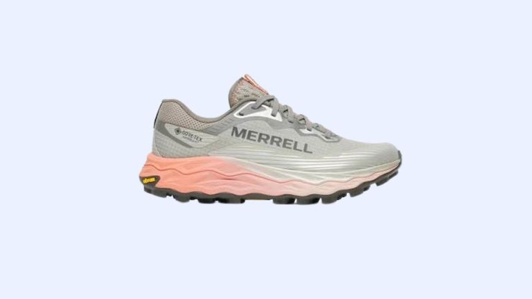 A grey-and-pink Merrell sneaker against a blue background.