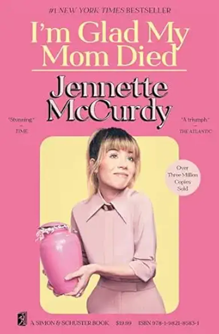 Pink cover image of "I'm Glad My Mom Died" by Jennette McCurdy featuring a photo of the author holding an urn.